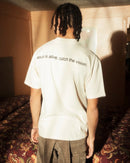 "I AM FREE"  T-SHIRT (UNISEX) - SAND